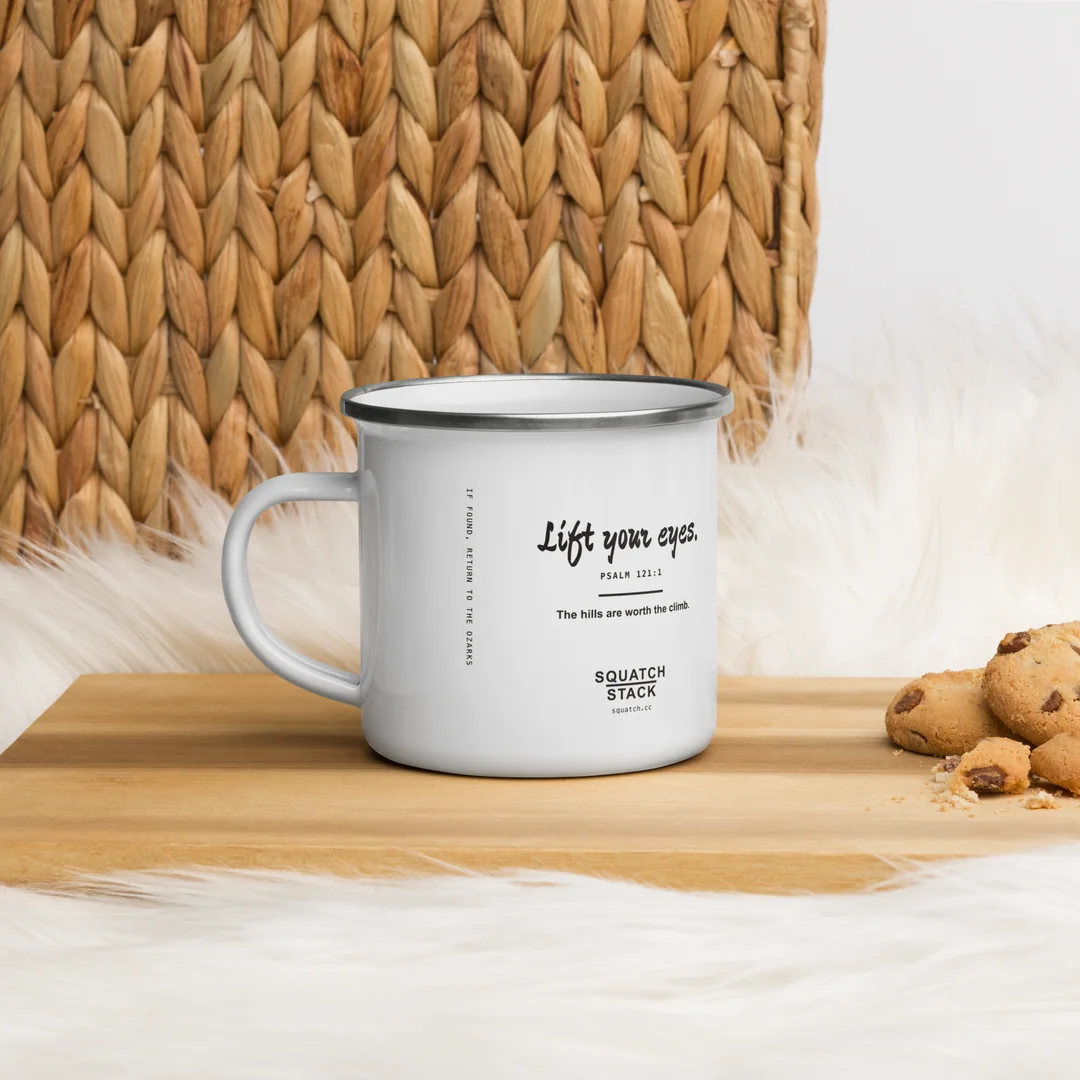 The Lift Your Eyes camp mug, the back, by the fire blanket.
