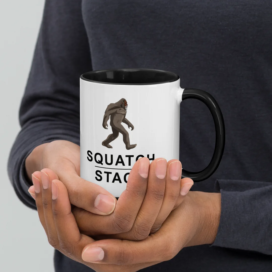 The Founder mug, held in two hands.