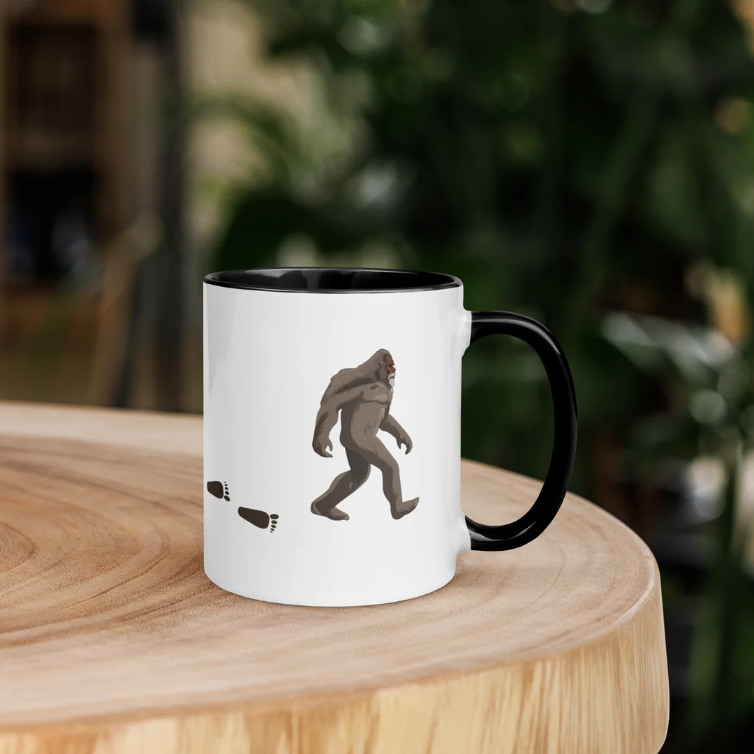The Founder’s Walk mug on a wooden stump.