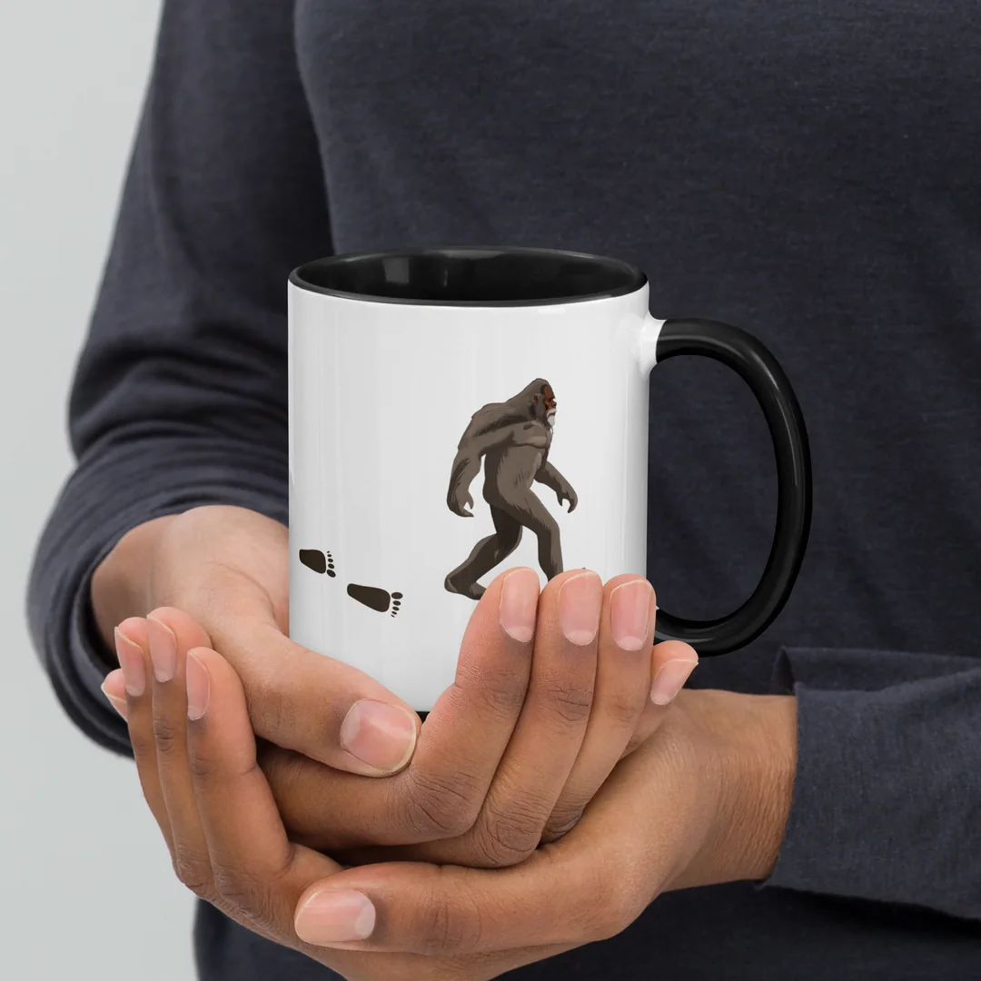 The Founder’s Walk mug, held in two hands.
