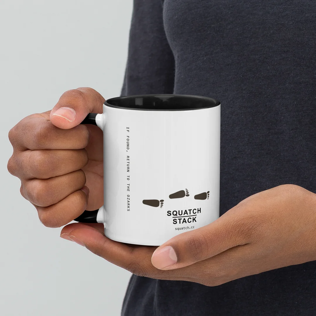 The Founder’s Walk mug, held by the handle.